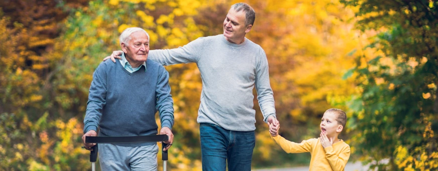 Life Assure Elderly Father Aduly Son And Grandson Walk In Park Hero